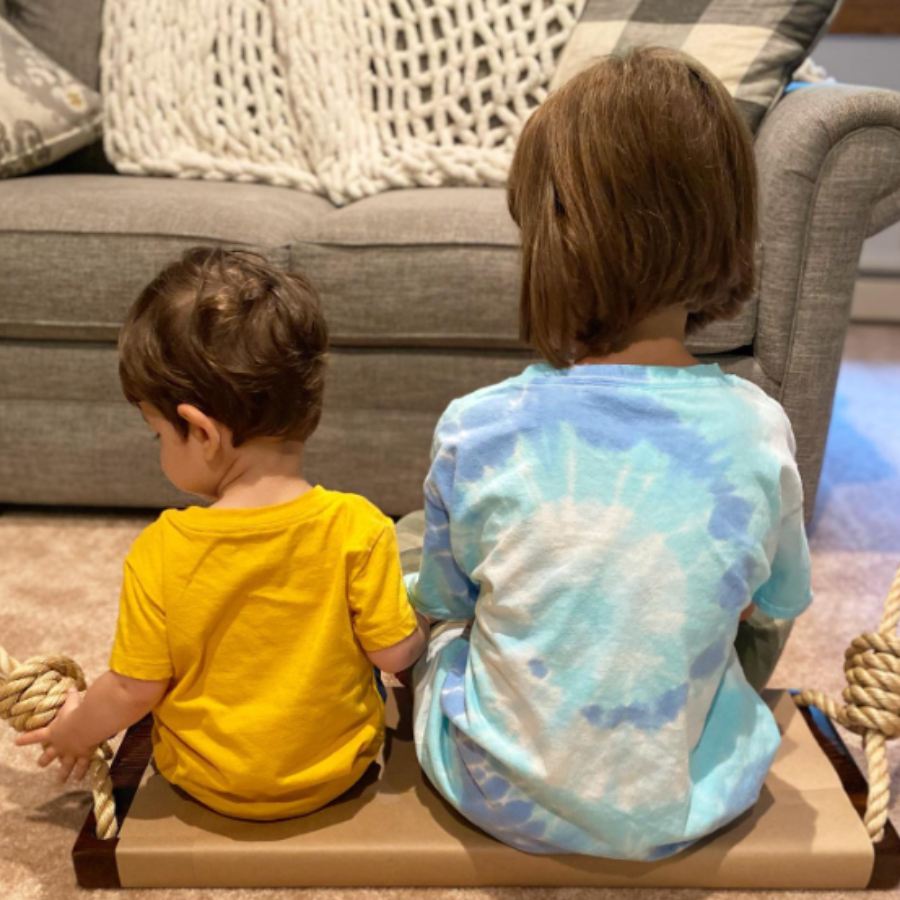 Large wooden swings for kids and adults.