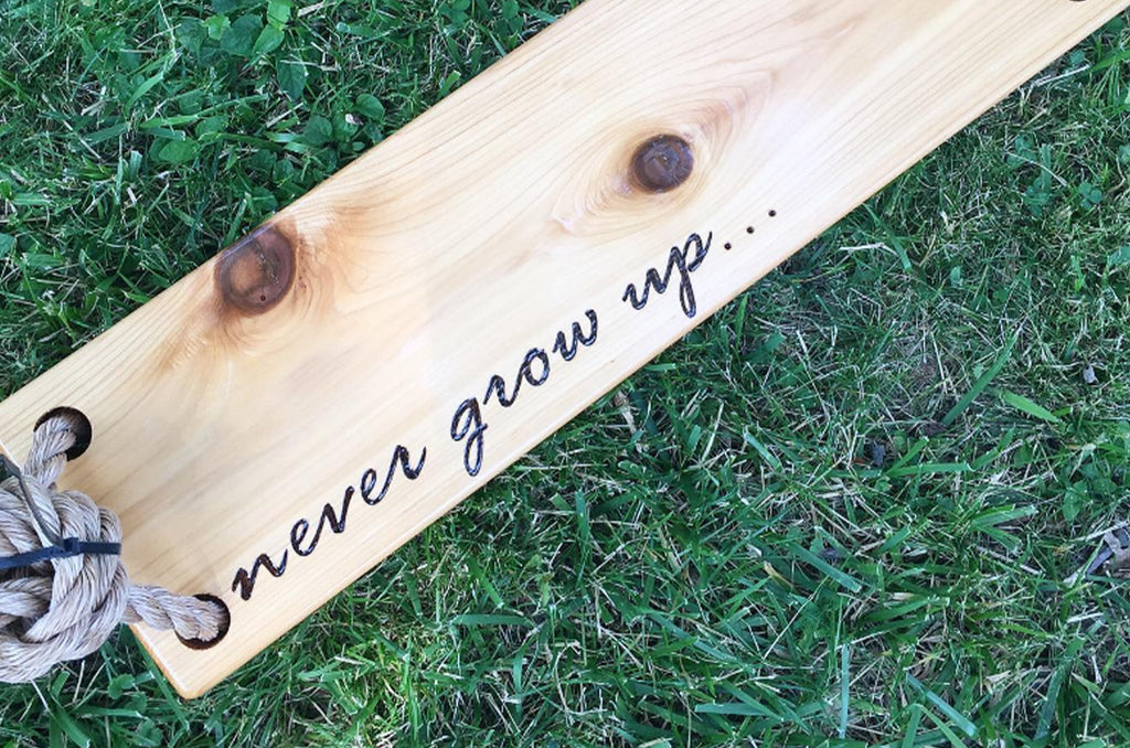 Never grow up wooden swing
